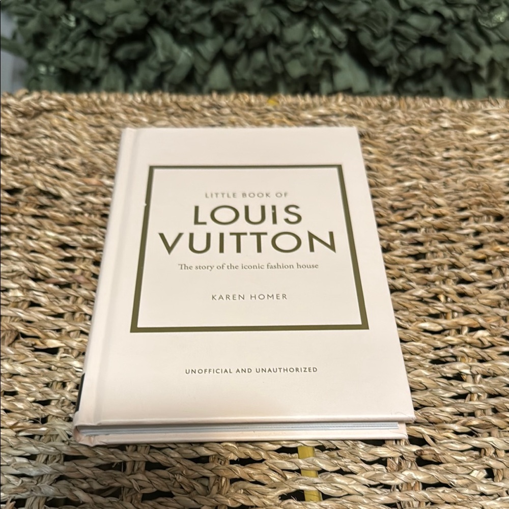 Louis Vuitton Cream Coffee Table Book with Bold Dark Text and Elegant Border